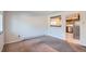 Open living room with a view into the kitchen at 6021 Yarrow St # B13, Arvada, CO 80004