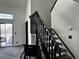 An interior staircase leading to the upper level of a home, showing the layout and design at 1825 Kendall St # 205, Lakewood, CO 80214