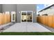 A stone walkway leads to the patio, with sliding glass doors for an indoor/outdoor living experience at 2466 S Cherokee St, Denver, CO 80223