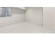 Spacious basement with carpeted flooring, window, and ample natural light at 2466 S Cherokee St, Denver, CO 80223