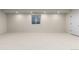 Spacious basement with carpeted flooring, window, and ample recessed lighting at 2466 S Cherokee St, Denver, CO 80223