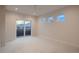 Bright, spacious bedroom with a sliding glass door leading to a private balcony at 2466 S Cherokee St, Denver, CO 80223