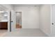 An empty bedroom leading to a bathroom and hallway at 2466 S Cherokee St, Denver, CO 80223