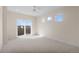 Bright bedroom with a sliding door and large windows at 2466 S Cherokee St, Denver, CO 80223