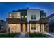 Modern townhomes showing a unique color scheme, landscaped yards, and welcoming covered front porches at 2466 S Cherokee St, Denver, CO 80223