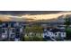 Scenic neighborhood view at sunset overlooking nearby buildings and mountain range in the distance at 2466 S Cherokee St, Denver, CO 80223