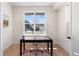 Office features a desk, chair, and a large window with a neighborhood view at 2466 S Cherokee St, Denver, CO 80223