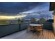 Outdoor patio area with wooden table and chairs, perfect for enjoying scenic views at 2466 S Cherokee St, Denver, CO 80223
