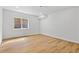 Clean basement with modern flooring and a window providing natural light at 9235 Quintero St, Commerce City, CO 80022