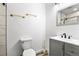 Modern bathroom with sleek vanity, updated fixtures, and a stylish mirror, creating a spa-like feel at 9235 Quintero St, Commerce City, CO 80022