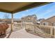 Covered deck overlooking a spacious backyard, perfect for outdoor entertaining and relaxation at 9235 Quintero St, Commerce City, CO 80022