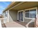 Covered deck area offering a perfect outdoor retreat with a sliding glass door entry at 9235 Quintero St, Commerce City, CO 80022