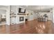 Spacious living room features a fireplace and open floor plan to the kitchen at 9235 Quintero St, Commerce City, CO 80022