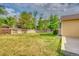 Spacious backyard featuring a well-maintained lawn and a wooden fence at 3100 S Corona St, Englewood, CO 80113