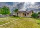 Spacious backyard featuring a lush green lawn, pathway, and a well-maintained fence at 3100 S Corona St, Englewood, CO 80113