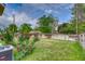 Spacious backyard featuring a well-maintained lawn, garden, and a wooden fence at 3100 S Corona St, Englewood, CO 80113