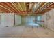 Unfinished basement offering a blank canvas with exposed beams, concrete walls and floor at 3100 S Corona St, Englewood, CO 80113