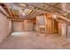 Large unfinished basement with exposed ceiling, concrete walls, and ample space for customization at 3100 S Corona St, Englewood, CO 80113