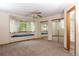 Bright bedroom features a ceiling fan, window seat, and closet with mirrored doors at 3100 S Corona St, Englewood, CO 80113
