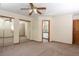 Neutral primary bedroom with carpet and mirror closet doors at 3100 S Corona St, Englewood, CO 80113