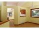 Bright dining area showing wood floors and seamless access to the kitchen, perfect for entertaining guests at 3100 S Corona St, Englewood, CO 80113