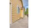 A close-up of the home's exterior, showcasing the siding, windows, and walkway at 3100 S Corona St, Englewood, CO 80113