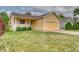 Charming single Gathering home with a manicured lawn, porch, and two car garage at 3100 S Corona St, Englewood, CO 80113