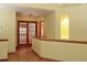 Second floor landing featuring wood flooring and wood accents with an open view at 3100 S Corona St, Englewood, CO 80113