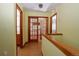 Second floor hallway featuring wood flooring with access to rooms with wood doors at 3100 S Corona St, Englewood, CO 80113