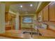 Bright kitchen featuring matching appliances, wood cabinets and a spacious window above the sink at 3100 S Corona St, Englewood, CO 80113