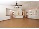 Spacious living area with wood floors, light walls, and an open layout leading to the kitchen at 3100 S Corona St, Englewood, CO 80113