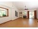 Bright living room with a fireplace, vaulted ceilings, and sliding glass doors to the backyard at 3100 S Corona St, Englewood, CO 80113