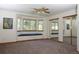 Comfortable main bedroom offers a window seat with storage and mirrorred closet doors at 3100 S Corona St, Englewood, CO 80113