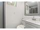 Bright bathroom with a vanity and a mirror with lots of natural light at 1264 Beaver Brook Canyon Rd, Evergreen, CO 80439