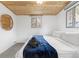 Serene bedroom with a cozy bed, soft linens and bright natural light at 1264 Beaver Brook Canyon Rd, Evergreen, CO 80439