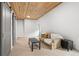 Charming room featuring white walls, wood ceiling, and comfortable seating at 1264 Beaver Brook Canyon Rd, Evergreen, CO 80439