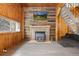 Living room with stone fireplace and TV perfect for relaxing evenings at 1264 Beaver Brook Canyon Rd, Evergreen, CO 80439