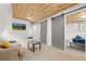 Cozy living room with comfortable seating, TV, and access to bedroom at 1264 Beaver Brook Canyon Rd, Evergreen, CO 80439