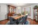Elegant dining room with a wooden table, upholstered chairs, and a stylish display cabinet at 1152 Clubhouse Dr, Broomfield, CO 80020