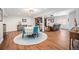 Open dining area with seating for four and direct view to the living room and bar at 1152 Clubhouse Dr, Broomfield, CO 80020