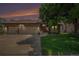 Charming brick home with a well-manicured lawn, mature tree, and attached three-car garage at 1152 Clubhouse Dr, Broomfield, CO 80020