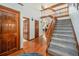 Inviting foyer with hardwood floors, staircase leading to an upper level, and natural light at 1152 Clubhouse Dr, Broomfield, CO 80020