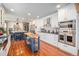Modern kitchen featuring stainless steel appliances, white cabinets, and a butcher block island with storage at 1152 Clubhouse Dr, Broomfield, CO 80020