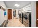 Functional laundry room equipped with modern washer and dryer, and closet access at 1152 Clubhouse Dr, Broomfield, CO 80020