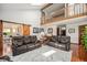 Spacious living room with hardwood floors, vaulted ceiling, and an open view of other rooms at 1152 Clubhouse Dr, Broomfield, CO 80020