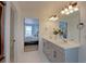 Double vanity bathroom with view into main bedroom at 615 W 174Th Pl, Broomfield, CO 80023