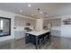 Modern kitchen with gray cabinets, white quartz countertops, and an island at 615 W 174Th Pl, Broomfield, CO 80023