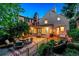 Inviting backyard featuring an outdoor seating area, brick patio, and lush greenery at 428 N Humboldt St, Denver, CO 80218