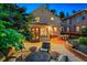 Charming backyard with cozy seating, mature trees, and a brick patio at 428 N Humboldt St, Denver, CO 80218
