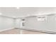 A finished basement area with clean white walls and vinyl flooring at 428 N Humboldt St, Denver, CO 80218